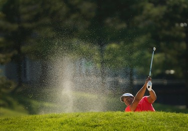 Jhonattan Vegas, of Venezuela, hits from the bunker on the 18th hole playoff during the 2017 Canadian Open at the Glen Abbey Golf Club in Oakville, Ont., on Sunday, July 30, 2017. Vegas won the Canadian Open. THE CANADIAN PRESS/Nathan Denette ORG XMIT: NSD118