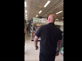 A Canadian Tire worker in Regina is seen in a video shot by Kamao Cappo. (Facebook)