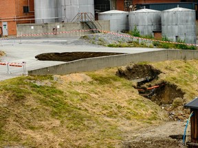 A hole at Domsjo Fabriker after a drainage pipe broke, Monday, July 31, 2017, in Ornskoldsvik north of Sweden, Monday, July 31, 2017. (Samuel Pettersson / TT via AP)