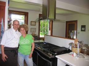 Submitted photo
Meg Hill and chief cook Michael Belanger are both excited at the new large sized gas stove installed in the Port Milford camp kitchen as a donation to the camp.