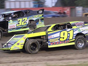 Doug O'Blenis (32) and Kraig Handley (91) battle it out during the Canadian modified feature event Saturday at Brighton Speedway. (Rod Henderson photo)