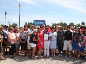 Fans gather around John Campbell during Legends Day festivities at the Clinton Raceway on Sunday. The day was a celebration of his final Hall of Fame harness drive.