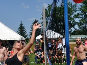 Chrissy Bannon (left), of We Always Get It Up, tips the volleyball over the net during action from a six-team co-ed volleyball tournament this past Saturday, July 29, part of an all-day fundraiser in Monkton for 22-year-old Baydon Yundt called Breathe For Baydon. Yundt recently underwent a double lung transplant as he suffers from Cystic Fibrosis (CF), and the day’s events – including co-ed three-pitch, a silent auction, live auction and entertainment – took place under near perfect weather conditions. The event raised more than $30,000. ANDY BADER/MITCHELL ADVOCATE