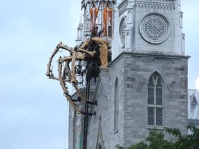 Kumo, the spider from La Machine on Notre Dame Cathedral in Ottawa, July 27, 2017.    Photo by Jean Levac   ORG XMIT: 127201