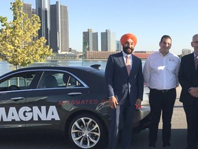 Minister of Innovation, Science and Economic Development Navdeep Bains and Minister of Transportation Steven Del Duca stand with representatives from Ontario’s Magna International and Michigan’s Continental Automotive North America. The two companies provided driverless cars on Monday that drove from Michigan and into Ontario, returning via Sarnia’s Blue Water Bridge to Michigan. (Handout)