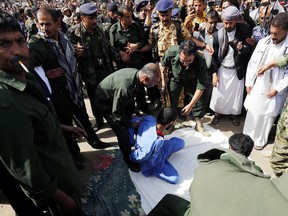 Yemeni security forces prepare to execute a man convicted of raping and murdering a three-year-old girl at a public square in the Yemeni capital Sanaa’s Tahrir Square on July 31, 2017. (Getty Images)