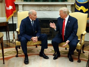 President Donald Trump talks with new White House Chief of Staff John Kelly after he was privately sworn in during a ceremony in the Oval Office Monday, July 31, 2017, in Washington. (AP Photo/Evan Vucci)