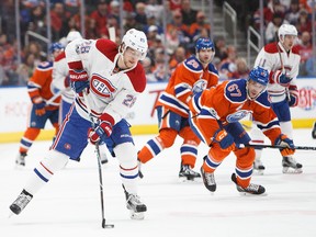 Benoit Pouliot #67 of the Edmonton Oilers keeps his eye on Nathan Beaulieu #28 of the Montreal Canadiens on March 12, 2017 at Rogers Place in Edmonton, Alberta, Canada. (Codie McLachlan/Getty Images)