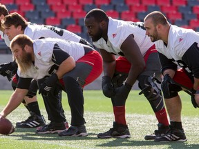 Ottawa RedBlacks offensive line (L-R) Jake Silas, Nolan MacMillan, Jon Gott, J'Micheal Deane, and Jason Lauzon-Seguin during team practice at TD Place on Oct. 17, 2016. (Errol McGihon/Postmedia)