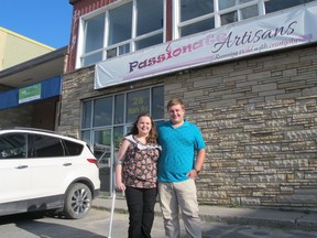 Amanda Stolk and Michael Amesse stand in the parking lot of Passionate Artisans at 28 Bath Rd., where they will hold a medical supply drive in August for their Kingston Indigenous Medical Aid Initiative. (Ashley Rhamey/For The Whig-Standard)