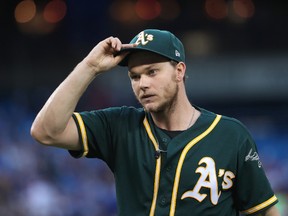 Sonny Gray #54 of the Oakland Athletics walks to his dugout after retiring the side in the third inning during MLB game action against the Toronto Blue Jays at Rogers Centre on July 25, 2017 in Toronto, Canada. (Tom Szczerbowski/Getty Images)