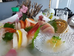 Takami’s deluxe sashimi floats in a cloud of dry ice.