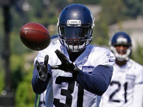 Seattle Seahawks strong safety Kam Chancellor catches the ball during an NFL football training camp, Monday, July 31, 2017, in Renton, Wash. (AP Photo/Ted S. Warren)