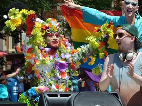 Riders on a float  during the annual London Pride parade on Queen's Avenue in London, Ontario on Sunday July 30, 2017.  (MORRIS LAMONT, The London Free Press)