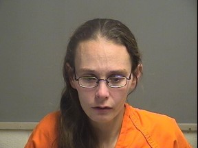 Katrina Layton, 34, (pictured) and Arturo Novoa, 31, were charged with corpse abuse at a home near Youngstown, Ohio. They are being held on $1-million bail.