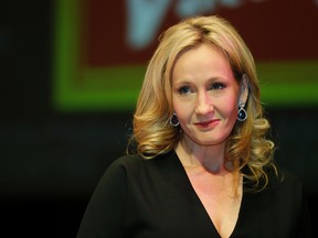 This is a Thursday, Sept. 27, 2012 file photo of British author J.K. Rowling as she poses for the photographers during photo call to unveil her new book, entitled: 'The Casual Vacancy', at the Southbank Centre in London. J.K. Rowling has apologized, Tuesday, Aug. 1, 2017, for tweets alleging that U.S. President Donald Trump refused to shake the hand of a disabled boy. (AP Photo/Lefteris Pitarakis, File)