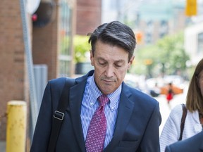 Dr. Nigel Mark Phipps leaves a College of Physicians and Surgeons disciplinary hearing in Toronto on Monday, July 31, 2017. (Ernest Doroszuk/Toronto Sun)