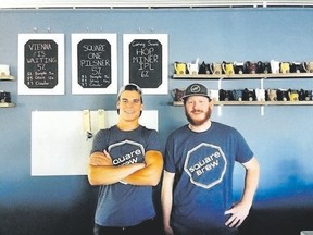 Square Brew?s Alex Menary, right, and Connor Brown opened their Goderich brewery in June. Their beer is available in one-litre cans called ?crowlers.? (Special to Postmedia News)