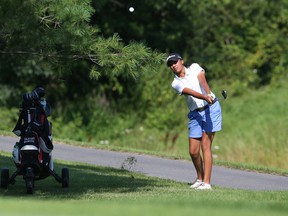 Vaijayanti Bharkhada, of Brampton, Ont., shoots out of the rough on the 18th hole during the first round of the Canadian Junior Girls Championship at Camelot Golf and Country Club in Ottawa on Tuesday. (Jean Levac/Postmedia Network)