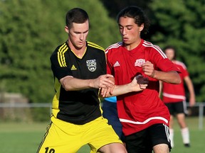 Colin McArthur, left, of the Wallaceburg Sting battles Christian Moccia of the Chatham Express during the first half of a Western Ontario Soccer League game at St. Clair College's Thames Campus in Chatham, Ont., on Saturday July 29, 2017. B.J. Charpentier and Casey McGee scored for the Sting in a 2-1 win in the Premier Division. Keegan Pittuck scored for the Express.