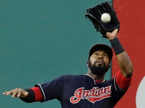 Indians outfielder Austin Jackson made a leaping catch at the wall to steal a home run from Red Sox batter Hanley Ramirez during MLB action in Boston on Tuesday. (Tony Dejak/AP Photo/Files)