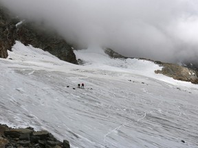 This undated picture released by the police in canton Valais shows the place at Hohlaub Glacier near Saas Fee, Switzerland where the body of a German hiker was found. The remains of the German hiker who disappeared while climbing in the Swiss Alps 30 years ago has been found at the Hohlaubgletscher above Saas Fee, Switzerland, on July 25 2017 by two climbers, police said on Wednesday, Aug. 2, 2017. (Police of Canton Valais/Keystone via AP)