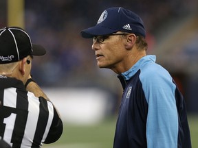 Argonauts head coach Marc Trestman (right) challenges a call during CFL action against the Blue Bombers in Winnipeg on July 13, 2017. (Kevin King/Winnipeg Sun)
