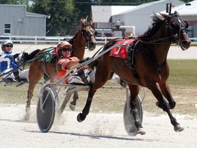 Horses make their way down the stretch during racing at the Dresden Raceway on Sunday, July 30. The last day of racing for this season at Dresden will be Monday, Aug. 7. (David Gough/Postmedia Network)