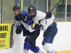 Sudbury Wolves first-round draft pick Blake Murray, right, battles for the puck with Bryce Lewis during the blue-white scrimmage at the Sudbury Wolves orientation camp in Sudbury, Ont. on Sunday April 23, 2017. Gino Donato/Sudbury Star/Postmedia Network
