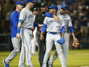 Marcus Stroman #6 of the Toronto Blue Jays is restrained by teammates and officials after a confrontation with the Chicago White Sox dugout at Guaranteed Rate Field on August 1, 2017 in Chicago, Illinois. (Michael Hickey/Getty Images)