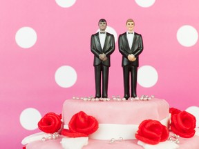 In this stock photo, 2 groom figurines top a wedding cake for a same-sex wedding. (Getty Images)