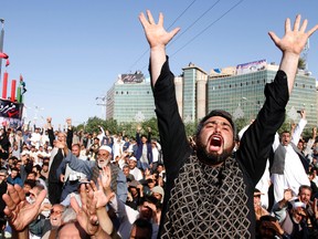 Protesters shout slogans during a demonstration in western Herat province of Afghanistan, Wednesday, Aug. 2, 2017. Thousands of angry residents carried the bodies of 31 people who died in a horrific suicide attack on a Shiite Mosque in western Herat. (AP Photo/Hamed Sarfarazi)