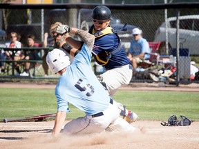 Sarnia Midget Braves catcher Jake Taylor prepares to tag a Springfield 16U baserunner during a round-robin game in the 2017 Stan Slack International Wood Bat Tournament at Stan Slack Field at Errol Russell Park. (RYAN KEMSLEY/Special to The Observer)