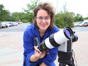 Lucie Robillard, a science communicator at Science North in Sudbury, Ont., shows a solar telescope that will be used to view a partial solar eclipse on August 21, 2017. The science centre is hosting a solar eclipse viewing from 1 p.m to 4 p.m. John Lappa/Sudbury Star/Postmedia Network