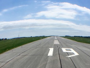 A light plane takes off from runway 19 at the Norman Rogers Airport in Kingston on Monday. The runway is to be lengthened on both ends as part of an airport expansion project. (Elliot Ferguson/The Whig-Standard)