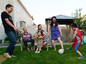 Ottawa's Jiang family lives together as a multi-family household. SEAN KILPATRICK / THE CANADIAN PRESS