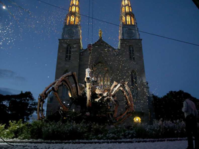 Kumo — the massive mechanical spider from La Machine — 'awoke' atop of Notre Dame Cathedral in Ottawa last Thursday. JULIE OLIVER / POSTMEDIA
