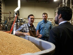 Culture and Tourism Minister Ricardo Miranda (right) is given a tour on the Nisku distillery by Geoff Stewart (left), owner and head distiller at Rig Hand Craft Distillery, after a press conference announcing 2017 Alberta Open Farm Days events and activities, which run on Aug. 19 - 20, 2017. Ian Kucerak / Postmedia