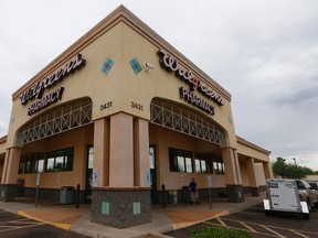 A local Walgreens remains closed Wednesday, Aug. 2, 2017, in Phoenix, after a customer at the drugstore shot and killed a man who was attempting to rob the pharmacy Tuesday night, according to police. (AP Photo/Ross D. Franklin)
