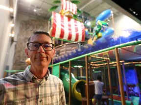 Del Tucker, the general manager for Fleetway shows off the venue?s five-storey, 10-metre high play structure on Oxford Street west in London. (MIKE HENSEN, The London Free Press)