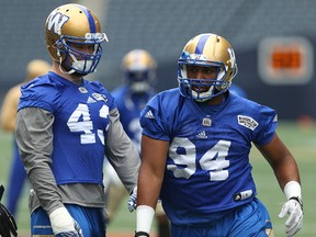 Jackson Jeffcoat steps around Trent Corney during a drill at Winnipeg Blue Bombers practice on July 11, 2017. (Kevin King/Winnipeg Sun/Postmedia Network)