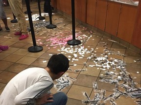A customer helps clean up a Chick-fil-A restaurant in Jacksonville, FL on July 31, 2017 after angry customers argued with employees. (Facebook/Allison Music)