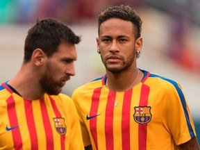 This file photo taken on July 22, 2017 shows Neymar (R) and Lionel Messi (L) of FC Barcelona warming up before the International Champions Cup (ICC) match between Juventus FC and FC Barcelona at the Met Life Stadium in East Rutherford, New Jersey. (Don Emmert/AFP/Getty Images)