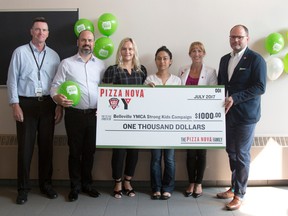 Taylor Bertelink/The Intelligencer
Ron Riddell, Vince Ambra, Liz Janik, Ansiba Nowrozi, Amanda Boldrick, and Sam Brady hold a check presented to the YMCA Strong Kids Campaign on Thursday morning. The campaign sits at $147,000 of a $170,000 goal.