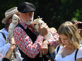 Music legend and wildlife advocate Mick Fleetwood, ambassador for the International Fund for Animal Welfare, holds a piece of ivory to be crushed during #IvoryCrush in Central Park in New York on Aug. 3, 2017. (GETTY IMAGES)