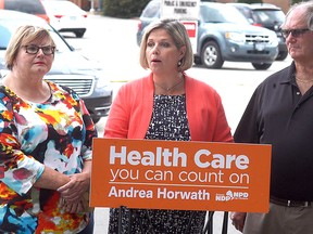 Ontario NDP leader Andrea Horwath speaks at a press conference in Wallaceburg, Ont. on Thursday, August 3, 2017, to talk about Sydenham District Hospital's funding designation. She is flanked by Wallaceburg-Walpole Island First Nation Health Coalition chair Shirley Roebuck and Save Our Sydenham chair Conrad Noel. (DAVID GOUGH, Postmedia News)