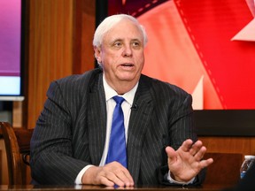In this March 22, 2017 file photo, West Virginia Gov. Jim Justice speaks during a town hall meeting, at WSAZ's studio in Huntington, W. Va. Justice is switching parties to join Republicans as President Donald Trump plans a visit to the increasingly conservative state. Justice's plans were confirmed to The Associated Press on Thursday, Aug. 3, by a Democratic Party official with knowledge of his plans. (Sholten Singer/The Herald-Dispatch via AP, File)