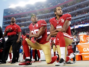 In this Monday, Sept. 12, 2016, file photo, San Francisco 49ers safety Eric Reid (35) and quarterback Colin Kaepernick (7) kneel during the national anthem before an NFL football game against the Los Angeles Rams in Santa Clara, Calif. (AP Photo/Marcio Jose Sanchez, File)