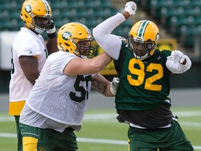 Danny Groulx, left, and Da'Quan Bowers take part in an Edmonton Eskimos team practice at Commonwealth Stadium, in Edmonton Wednesday Aug. 2, 2017.