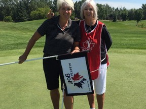 Kim Carrington, left, poses with her mother and caddie Shelley, Carrington-Jempson after winning the Alberta Senior Ladies Championship at the Edmonton Petroleum Golf and Country Club on Thursday, Aug. 3, 2017.